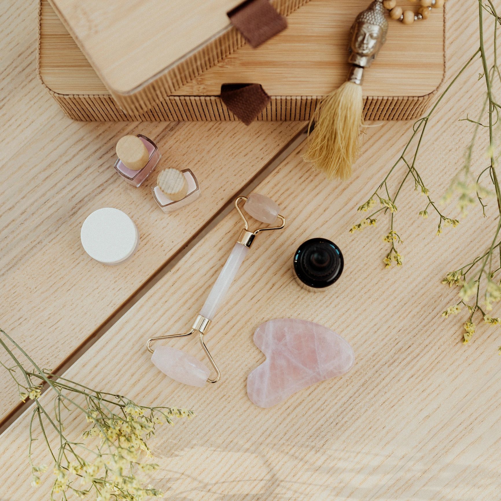Gua sha face stone and face oil still life