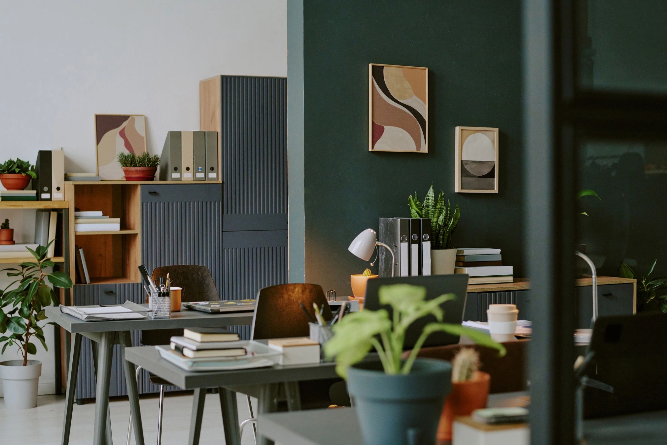 Minimalist modern office interior with plants and workstations