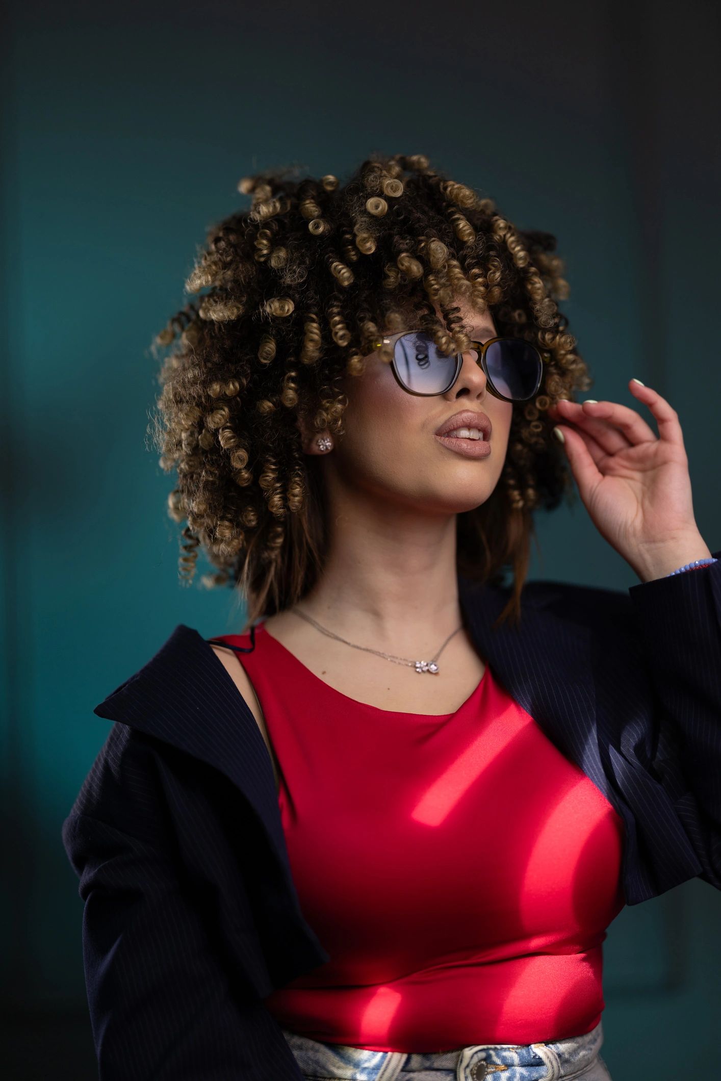 Stylish young woman wearing sunglasses in a fashion portrait
